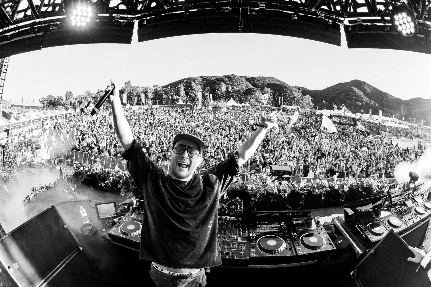 Cloverdale raising his arms in front of a festival crowd